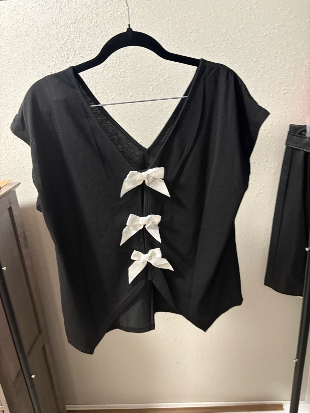 SHEIN Black V‑Back Top with White Bow Accents